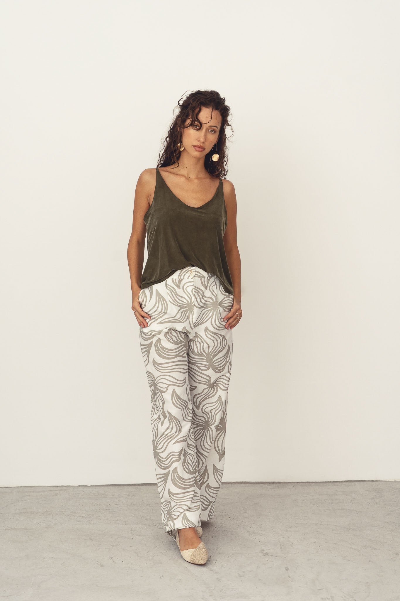 Naz women's breathable top with thin straps and deep neckline in green. Made from cupro.