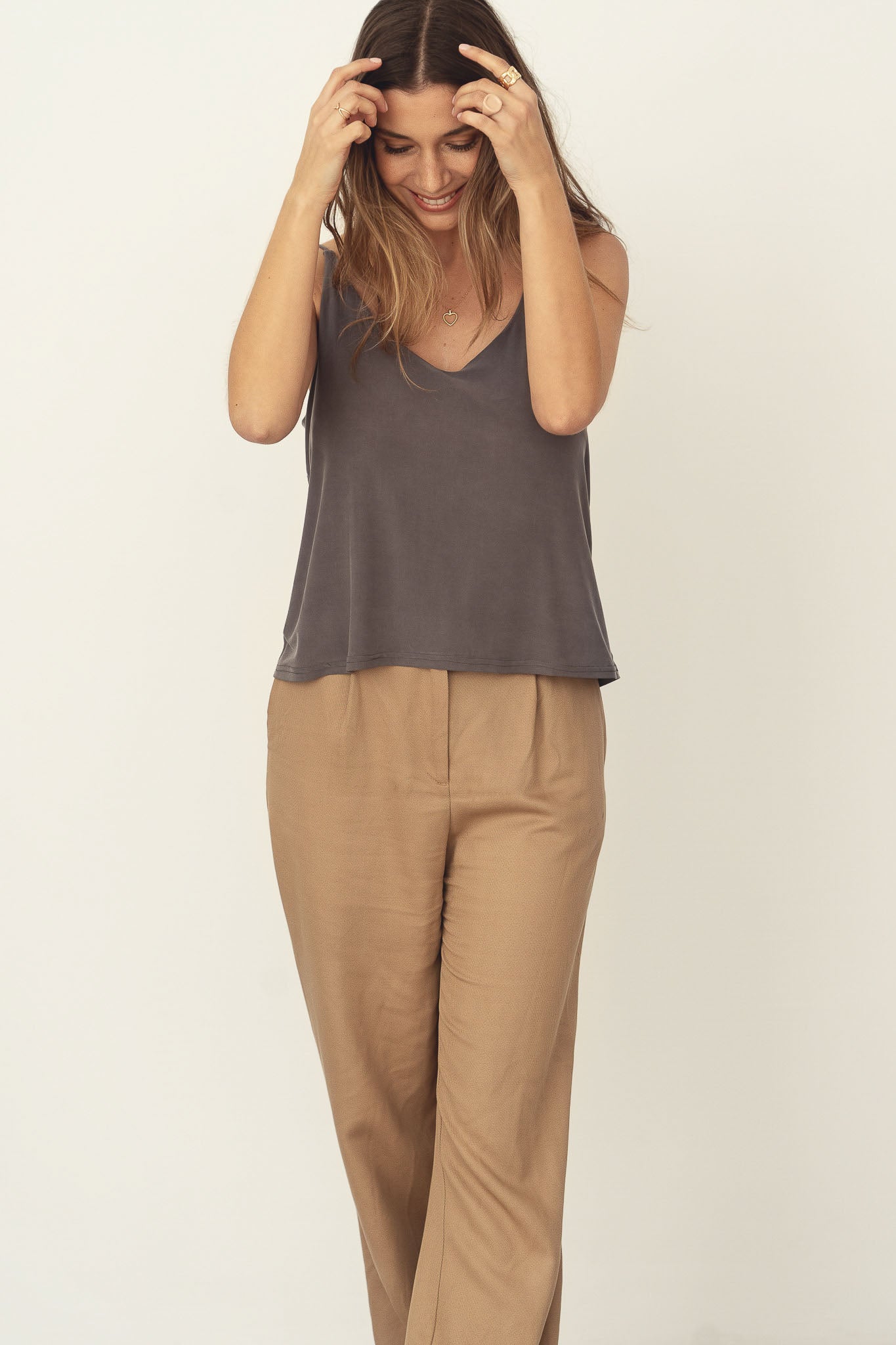 Naz women's soft top with thin straps and a deep neck line in grey. Made from cupro fabric in Portugal.