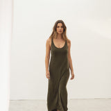 Naz women's midi dress made with silky cupro in dark green. With a side slit cross over back. 
