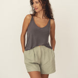 Naz women's linen shorts in sage green. Features a high-waist wide fit, front pleats and pockets. Made in Portugal.