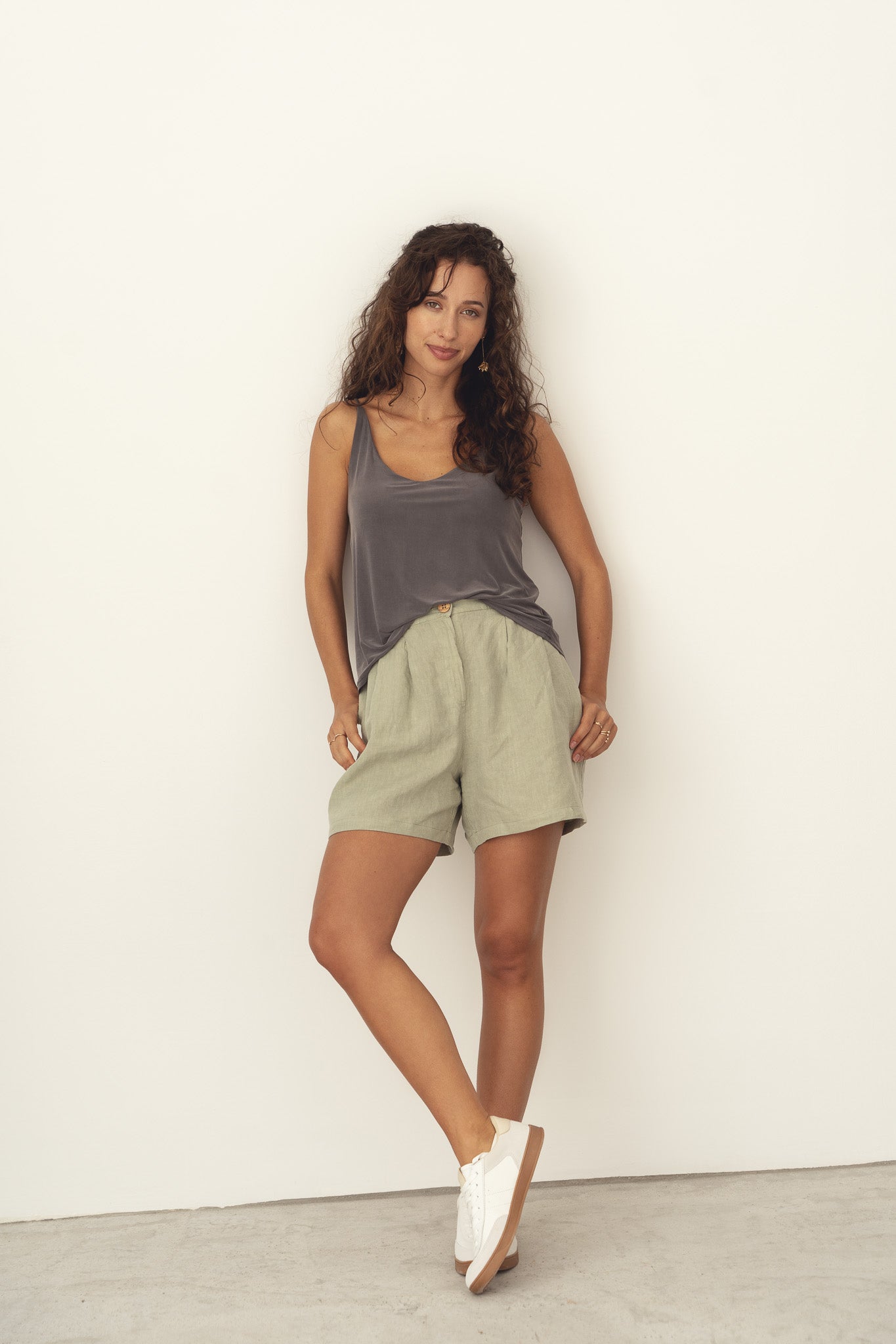 Naz women's linen shorts in sage green. Breathable fabric made in Portugal with lasting quality.