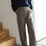 NAZ Mara Trousers in Beige. Made with 100% wool. Produced ethically in Portugal. Paired with the Agnes Wool Sweater in Navy