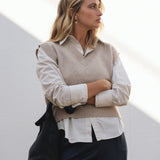 NAZ Alice Knit Vest in Beige. Made with 100% Recycled Wool. Paired with the Mara Wool Trousers in Navy.