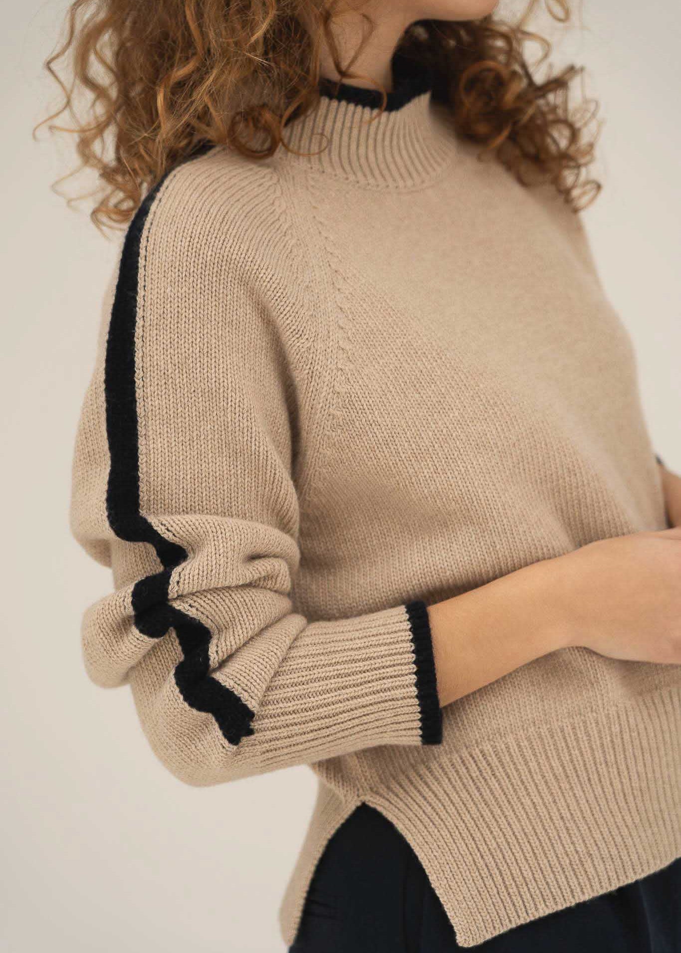 NAZ Agnes Sweater in Beige. Featuring a Navy color block detail. Made with 100% Recycled Wool.