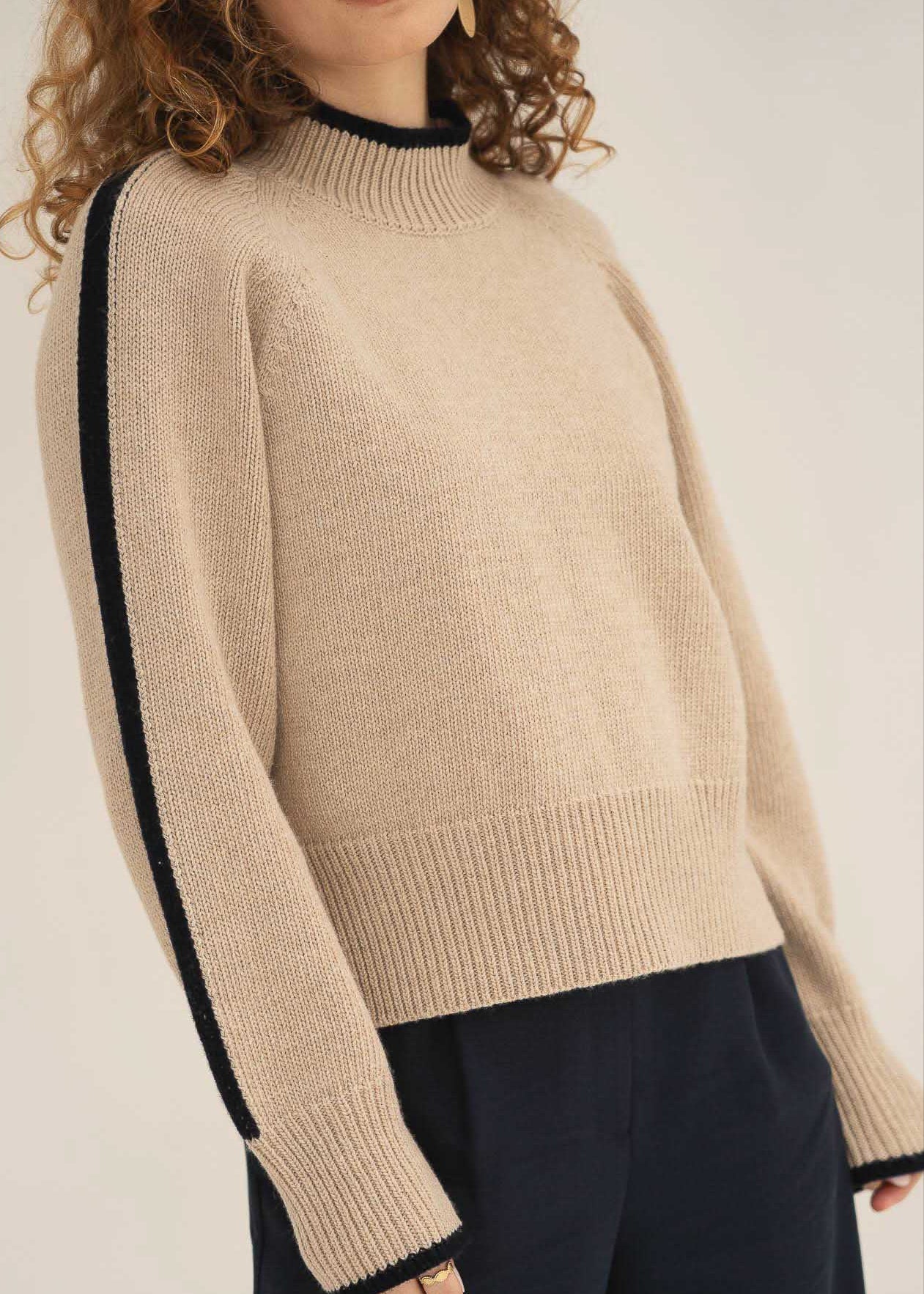 NAZ Agnes Sweater in Beige. Featuring a Navy color block detail. Made with 100% Recycled Wool.