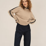 NAZ Agnes Sweater in Beige. Featuring a Navy color block detail. Made with 100% Recycled Wool.