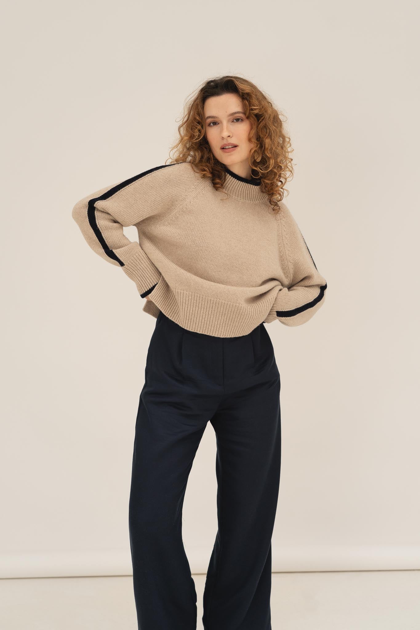 NAZ Agnes Sweater in Beige. Featuring a Navy color block detail. Made with 100% Recycled Wool.