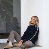 NAZ Agnes Sweater in Navy. Featuring a Beige color block detail. Made with 100% Recycled Wool.