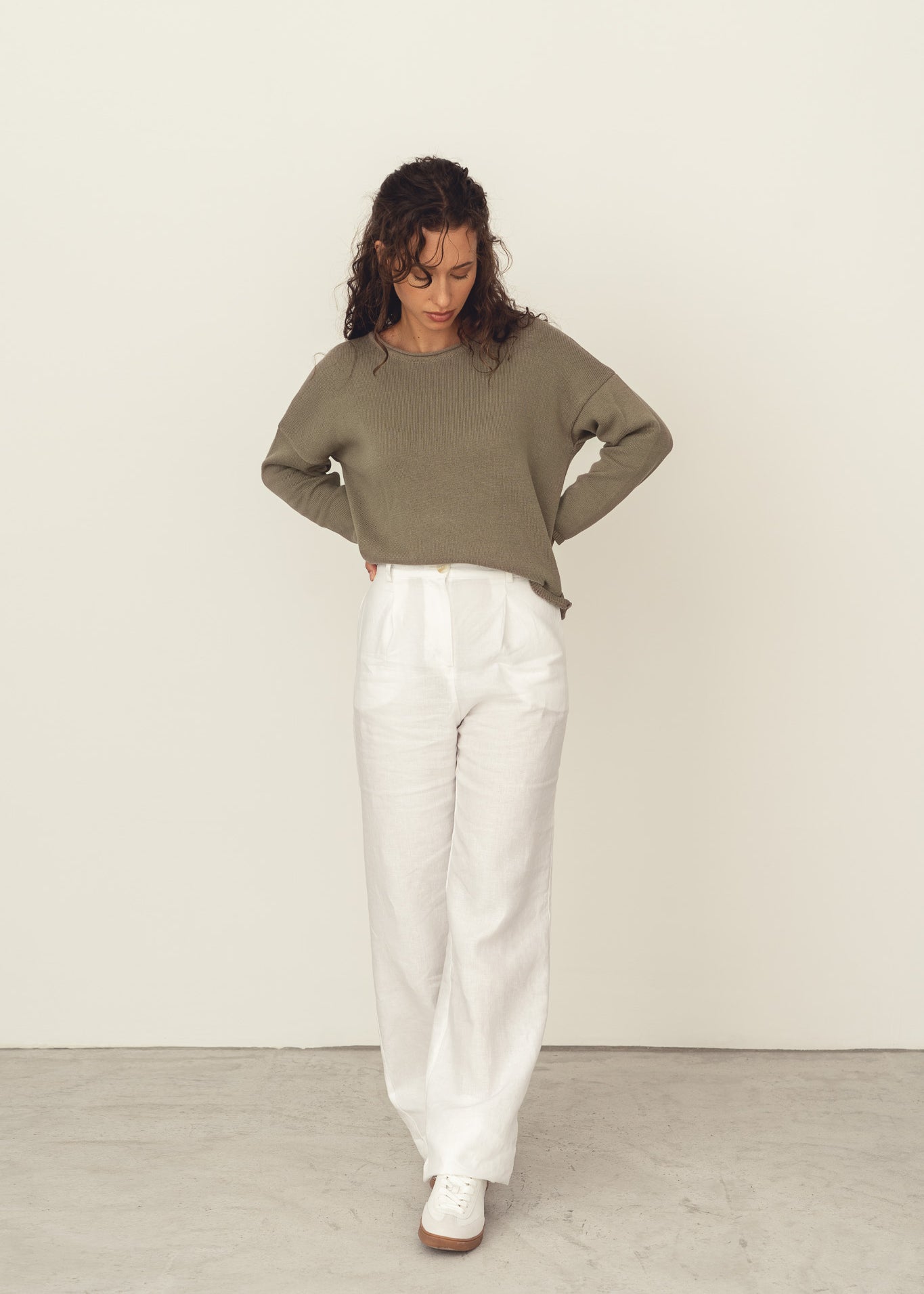 Naz women's recycled cotton knit sweater in sage green. Features an oversized fit and an elegant boat neck. Made ethically in Portugal. 