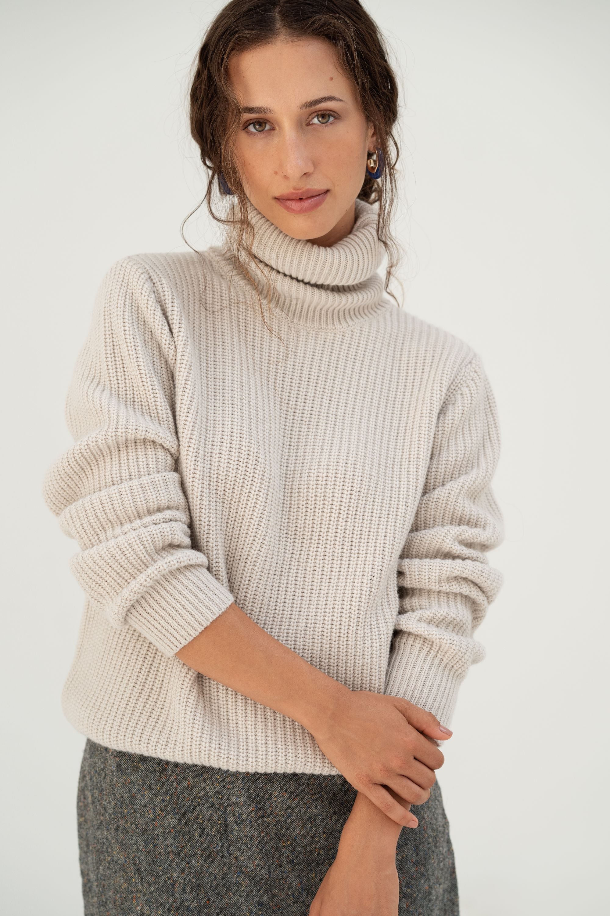 Naz women's turtleneck sweater made from 100% recycled fibers in white. 