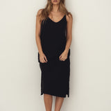 Naz's women's sustainable midi linen dress in black. Delicate straps, double fabric across the bust with hidden side pockets. 