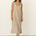 Naz's women's sustainable midi linen dress in beige. Features thin straps, double fabric across the bust with hidden side pockets. 