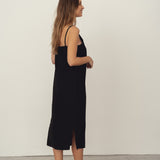 Naz's women's sustainable midi linen dress in black. Features thin straps, double fabric across the bust with hidden side pockets. 
