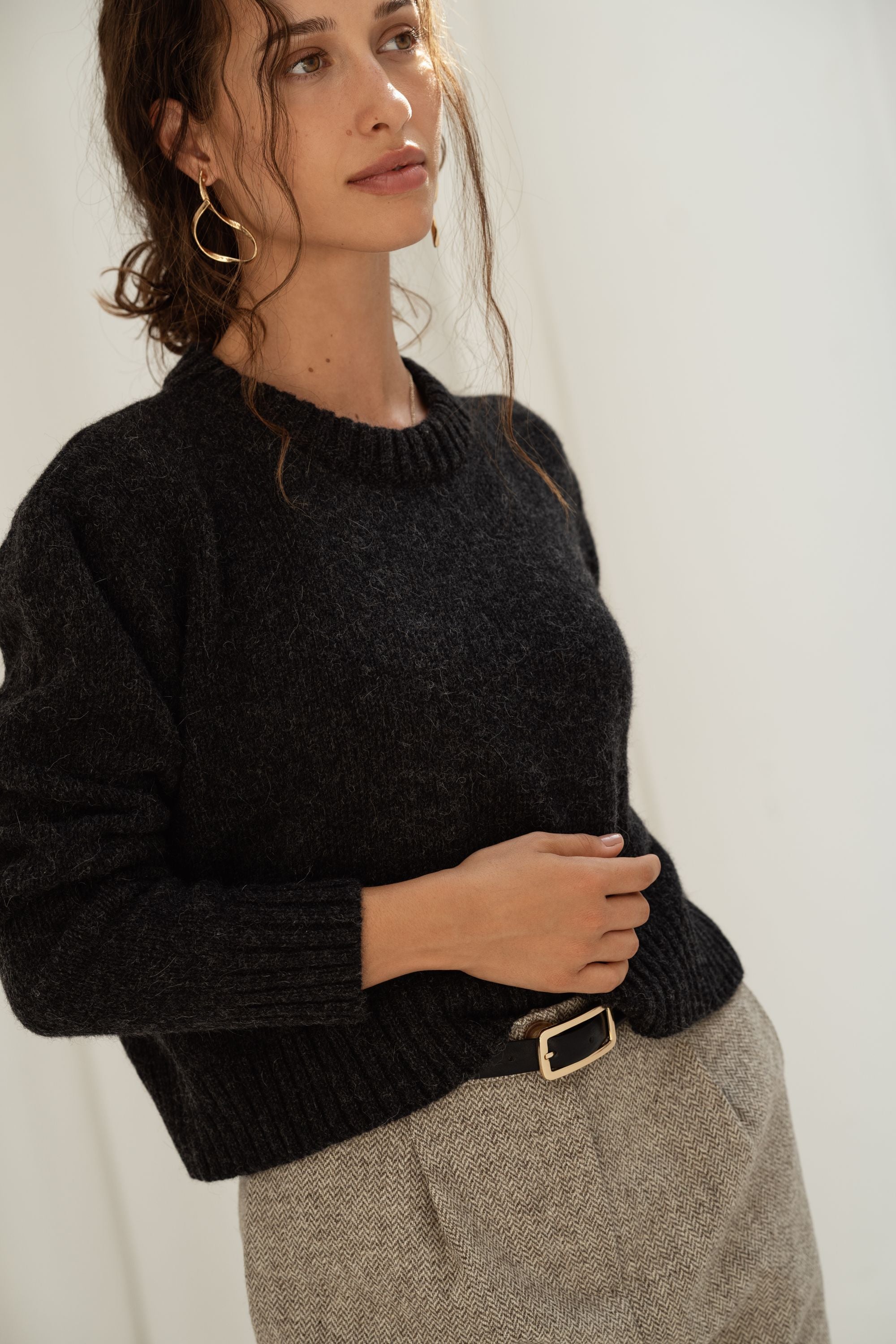 Women's crewneck jumper in recycled wool and alpaca blend in black.